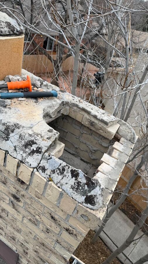 Damaged chimney crown before L&L's new cap, flue liner replacement, and crown seal