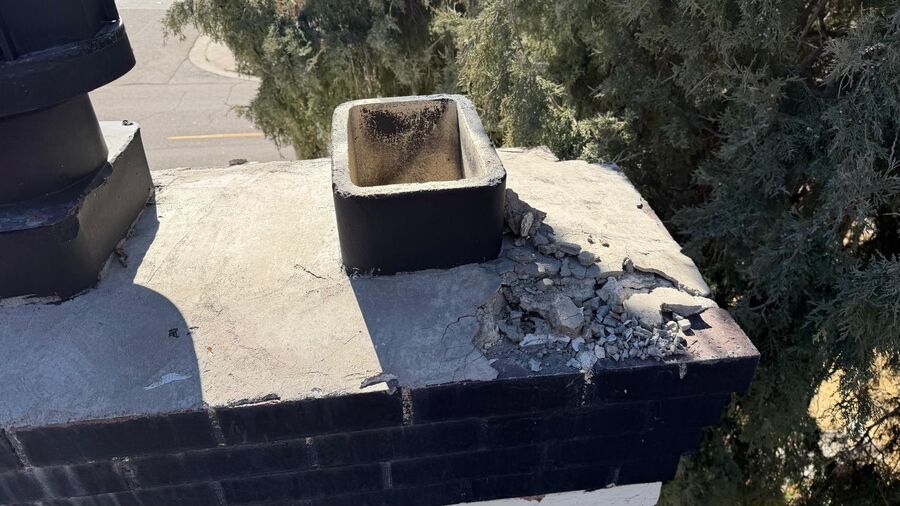 Cracked, crumbling chimney crown before L&L's repair