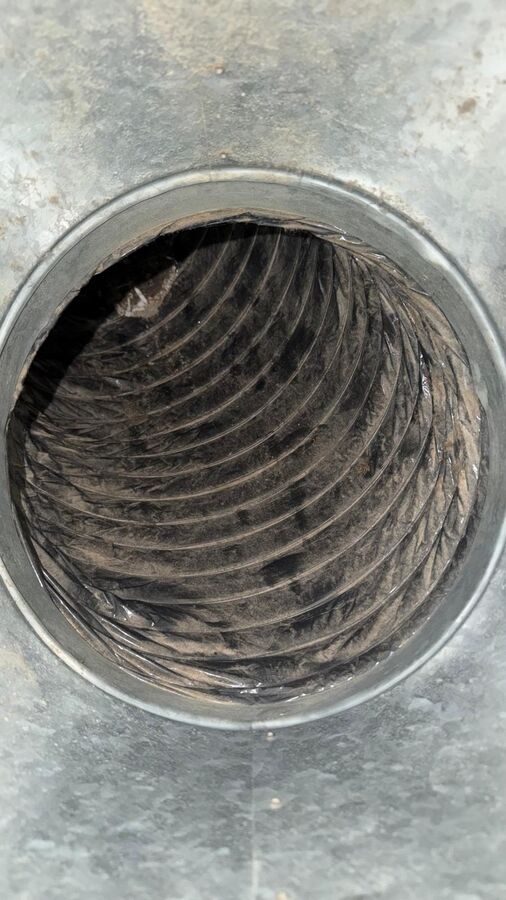 Return duct opening lined with dust before L&L's HVAC cleaning